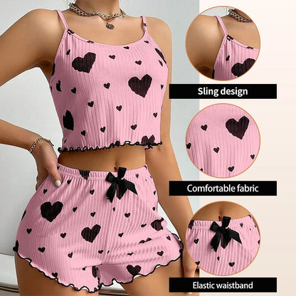 Pink Women's Pajamas Set - Soft Pajama Set with black heart print, highlighting sling design, comfortable fabric, and elastic waistband.
