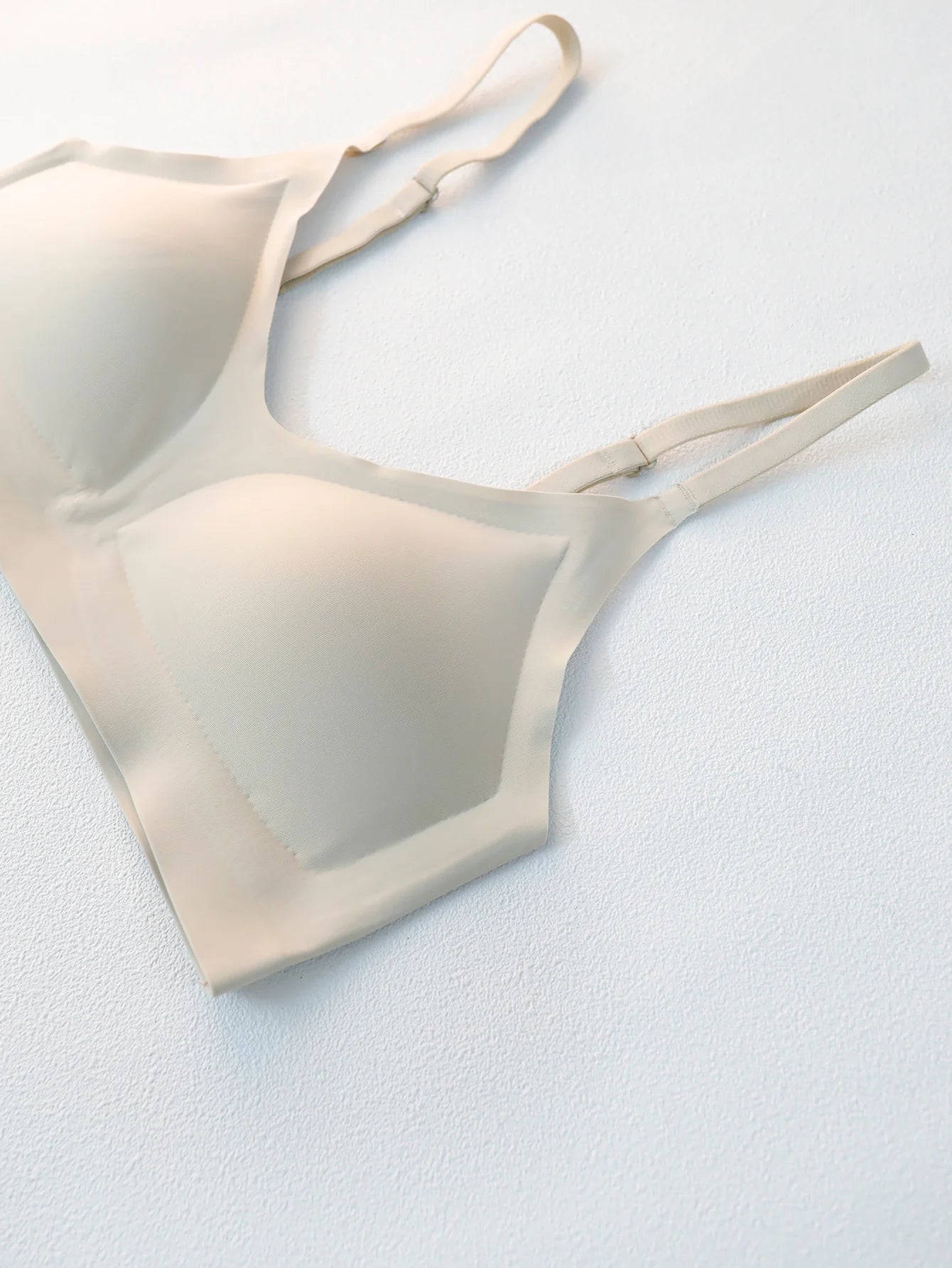 Flat lay of beige Seamless Underwear Bra Women - Soft Support, highlighting seamless construction and wireless design for invisible wear.
