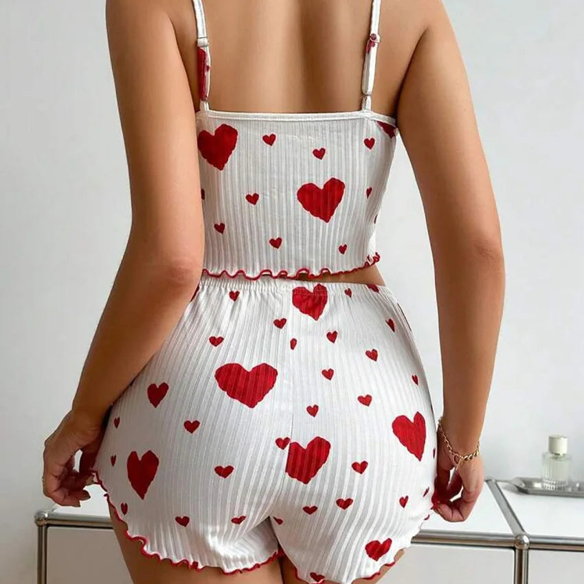 Rear view of white Women's Pajamas Set - Soft Pajama Set with red hearts, featuring a cropped top and high-waisted shorts.