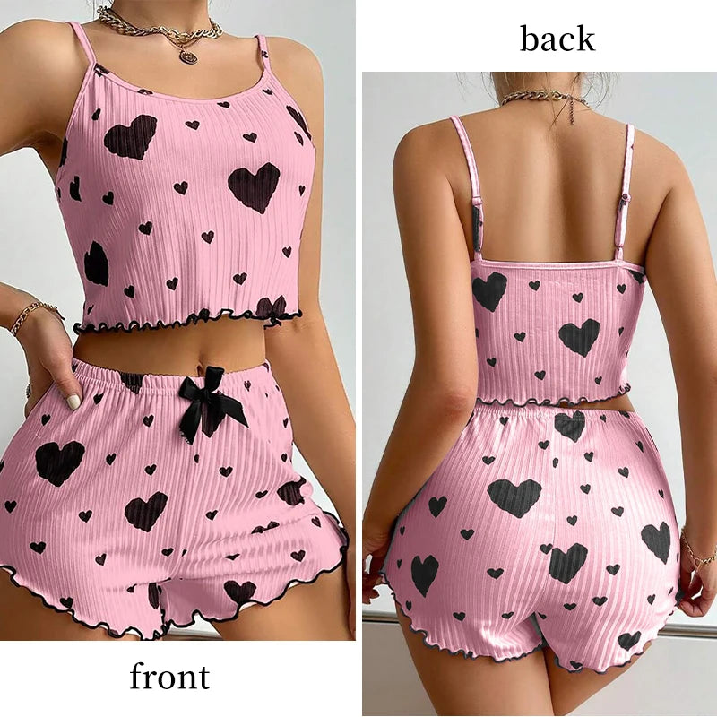 Front and back views of pink Women's Pajamas Set - Soft Pajama Set with black hearts, ideal for stylish and cozy lounging.