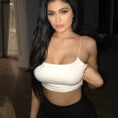 White Women's Sexy Tank Top with a snug fit and thin straps, styled for a confident and casual appearance.